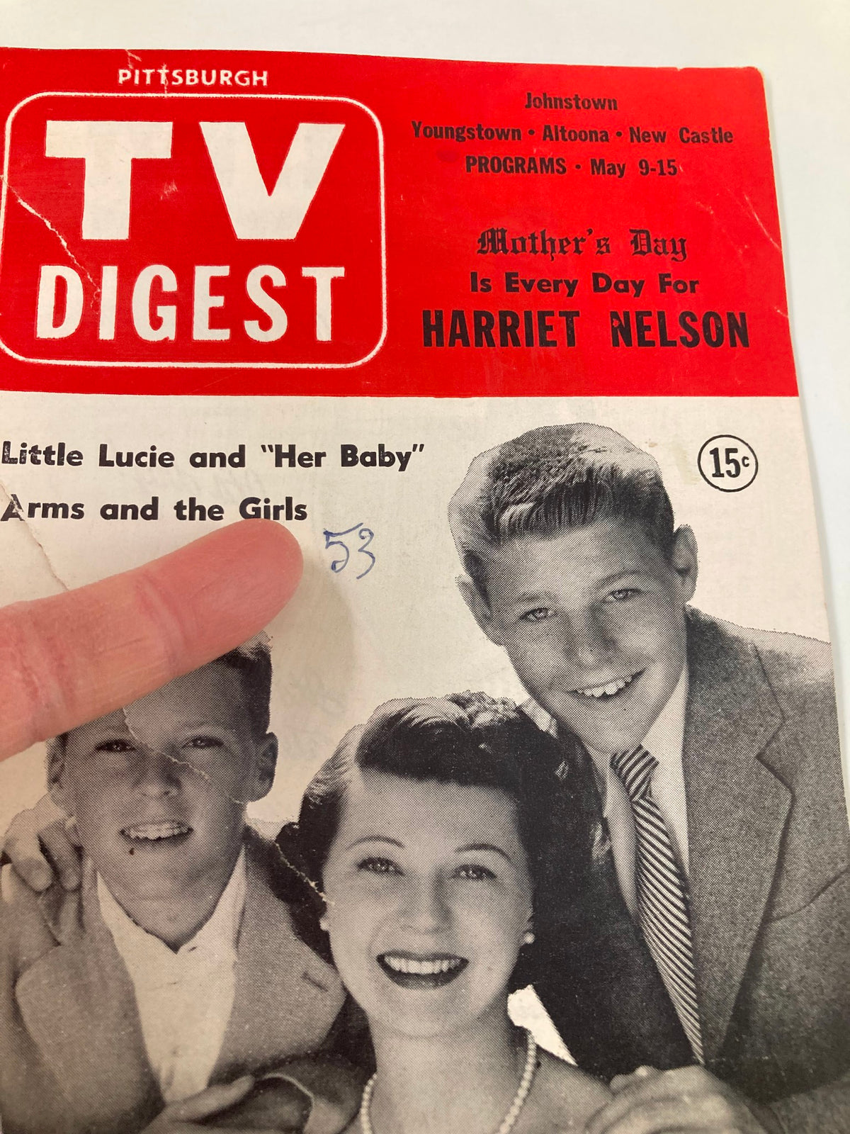Close-up of the TV Digest Magazine May 9, 1953 cover highlighting Harriet Nelson, with a finger pointing to the date and program details, embodying mid-20th-century television nostalgia.