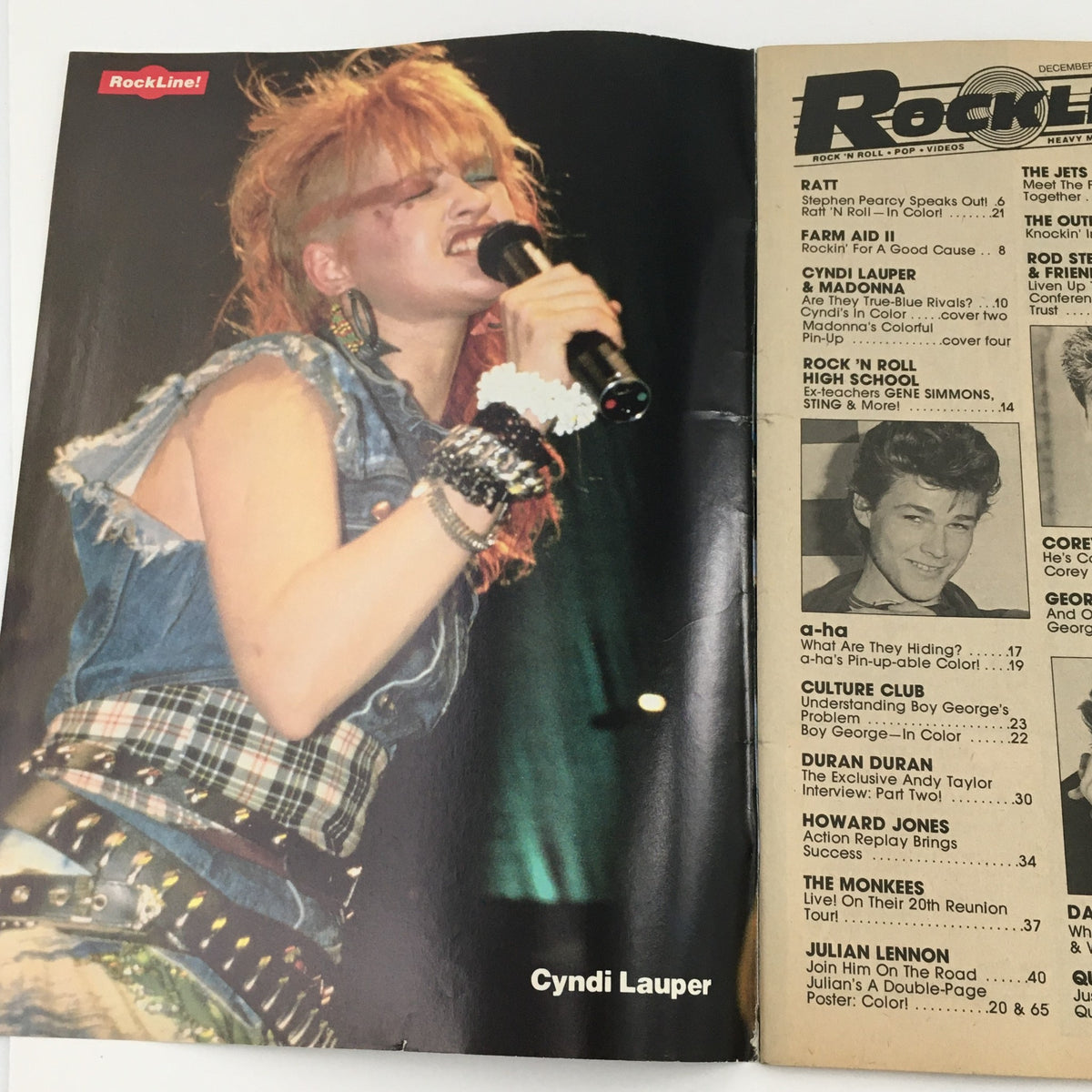 Cyndi Lauper performing live featured in the 16 Magazine Rockline! December 1986 issue, celebrating iconic 80s pop culture. This image showcases her vibrant fashion style.