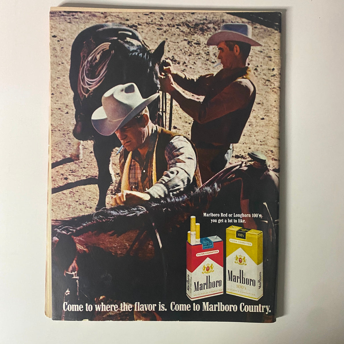 Advertisement page from Time Magazine July 25, 1969, featuring two cowboys on horseback promoting Marlboro cigarettes with the tagline 'Come to where the flavor is. Come to Marlboro Country.'