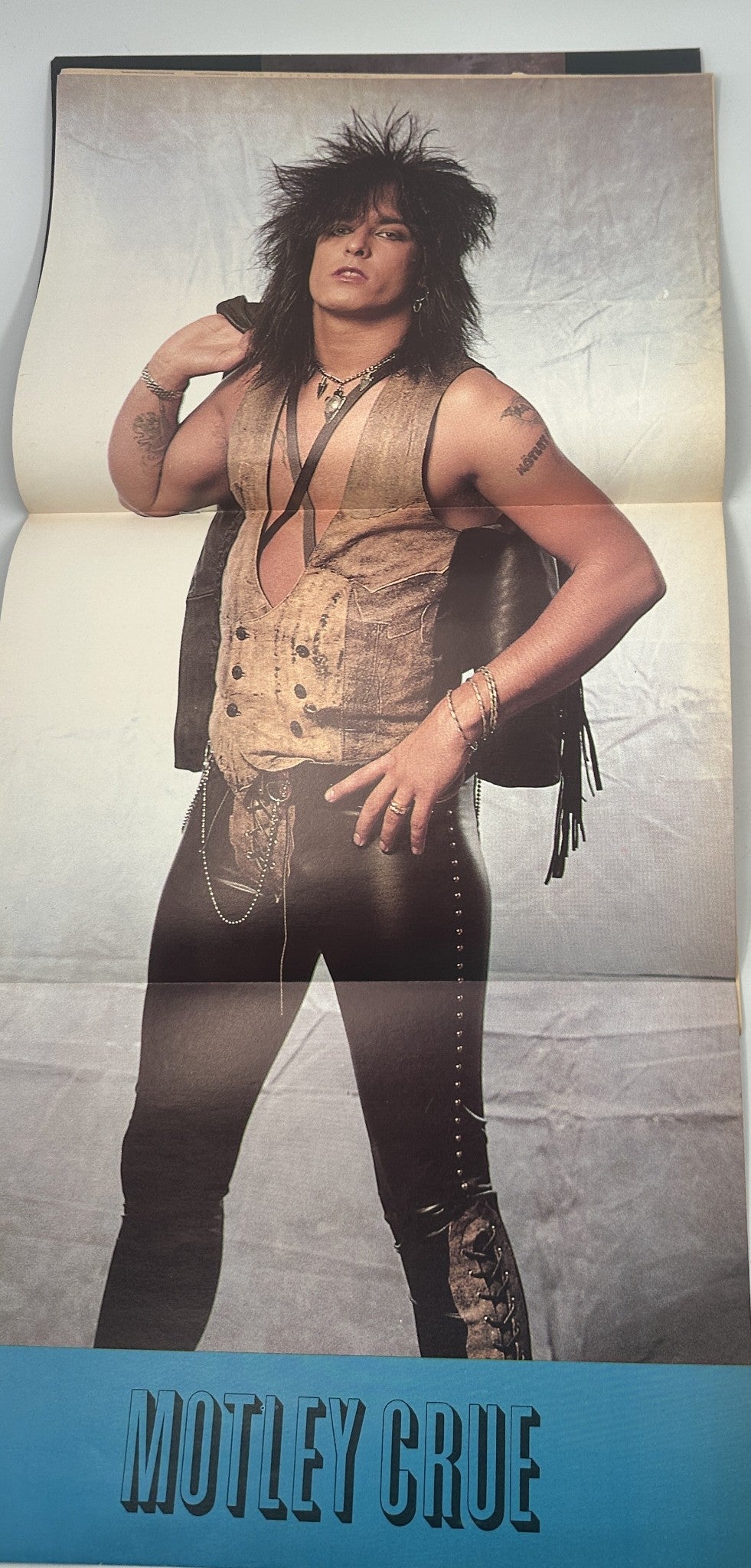 Centerfold poster of Motley Crue from Hit Parader Magazine June 1989, highlighting the band's iconic rock style and fashion.