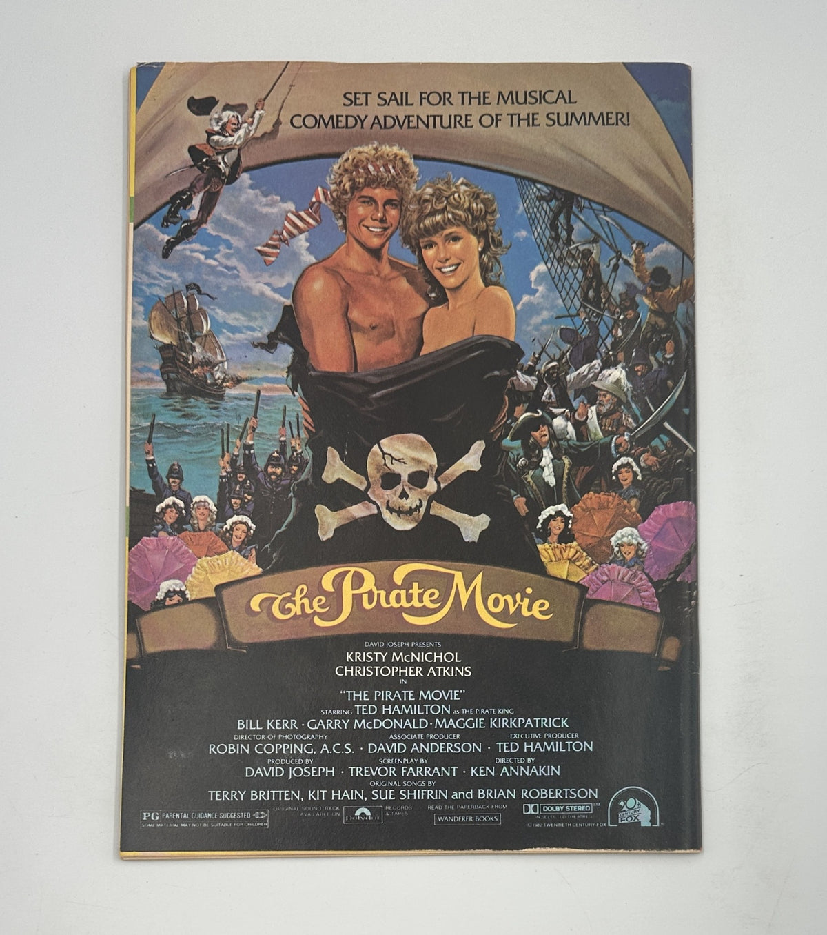 The Pirate Movie promotional poster featuring Kristy McNichol and Christopher Atkins, showcasing the musical comedy adventure theme.