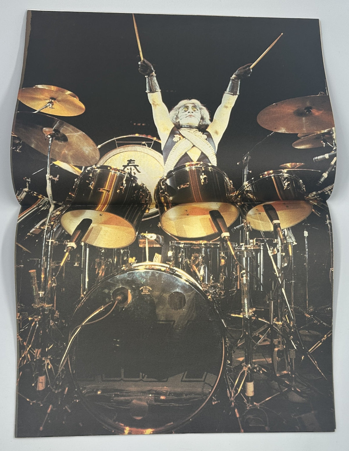 Centerfold of Hit Parader Magazine February 1979 showcasing a dynamic live performance of Peter Criss of KISS on drums. The image captures the energy and excitement of a rock concert.