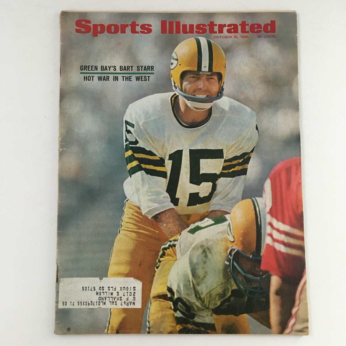 Cover of Sports Illustrated Magazine from October 31, 1966, featuring Bart Starr, quarterback for the Green Bay Packers, in action during an NFL game.