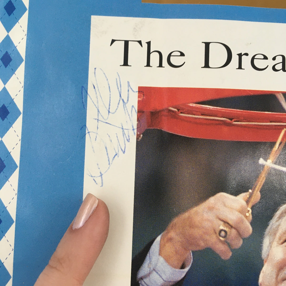 Close-up of Sports Illustrated Magazine The Dream Season North Carolina 1992-1993 cover, highlighting an autograph and celebratory details of the winning coach.