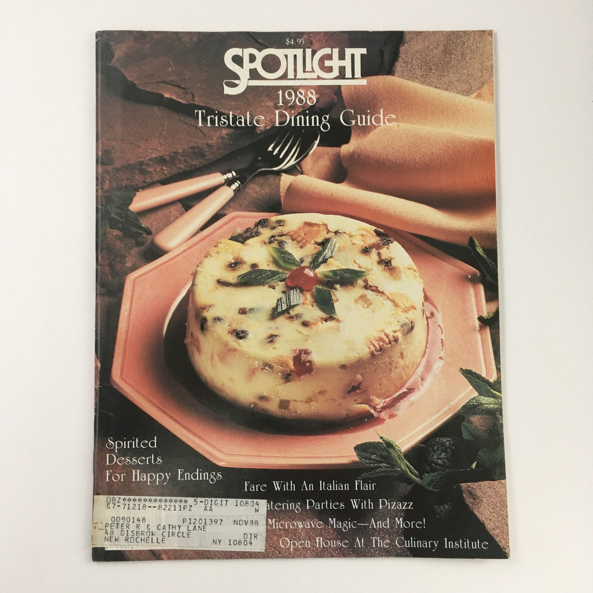 Cover of Spotlight Magazine 1988 Tristate Dining Guide featuring an Italian flair, showcasing a delectable dish on a decorative plate with utensils, highlighting vintage dining culture.