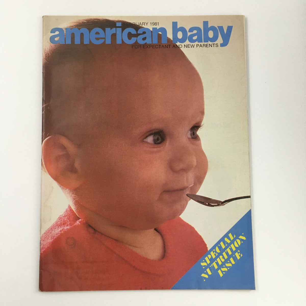 Cover of American Baby Magazine February 1981 - A Special Nutrition Issue featuring a baby holding a spoon, emphasizing nutrition for new parents.