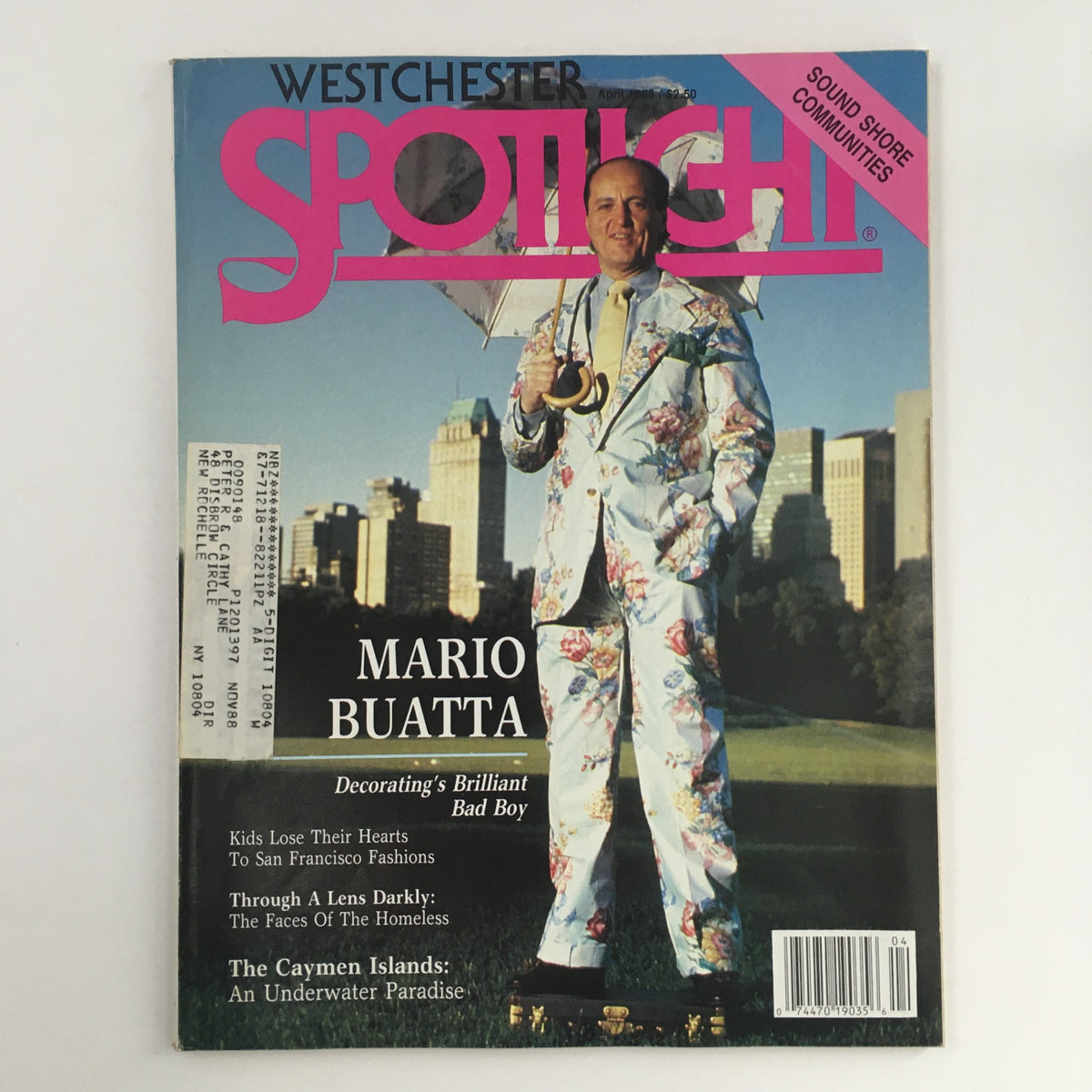 Spotlight Magazine April 1988 cover featuring Mario Buatta, Decorating's Brilliant Bad Boy, in a floral suit holding an umbrella, showcasing vintage magazine design and fashion trends.