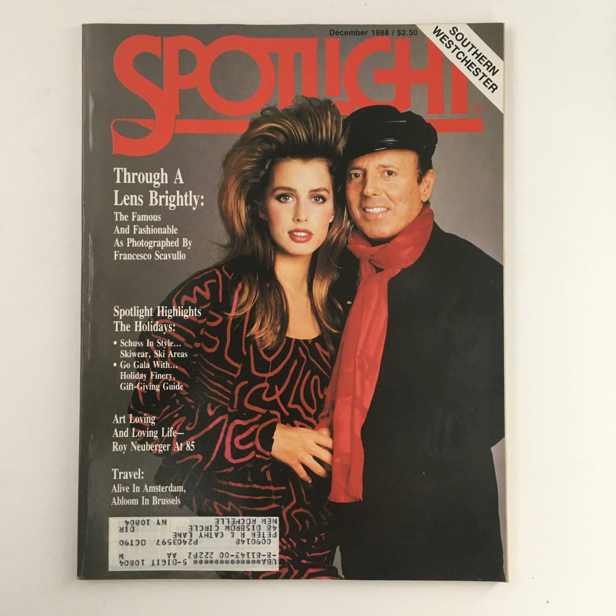 Cover of Spotlight Magazine December 1998: The Famous & Fashionable as Photographed, featuring a stylish model and a man in a black hat and red scarf, highlighting 90s fashion trends.