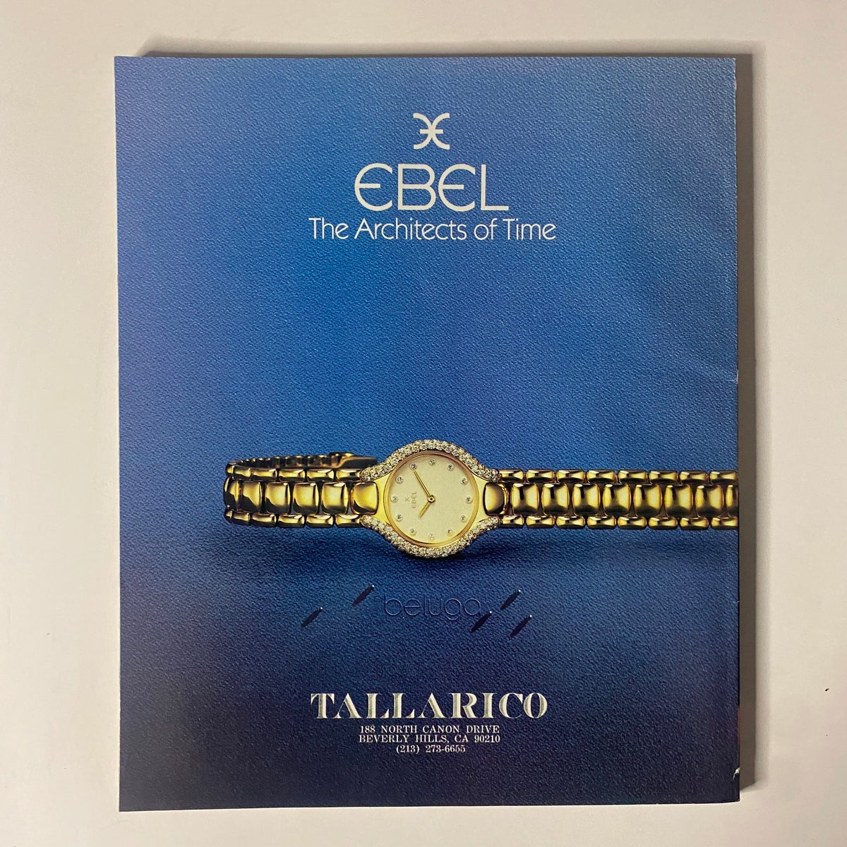 Connoisseur Magazine December 1986 - Advertisement for Ebel watches, illustrating luxury timepieces on a blue background.