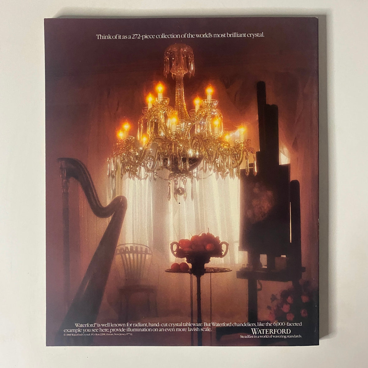 Advertisement from Connoisseur Magazine March 1988 for Waterford crystal chandeliers, emphasizing their brilliance and luxury in a sophisticated setting.