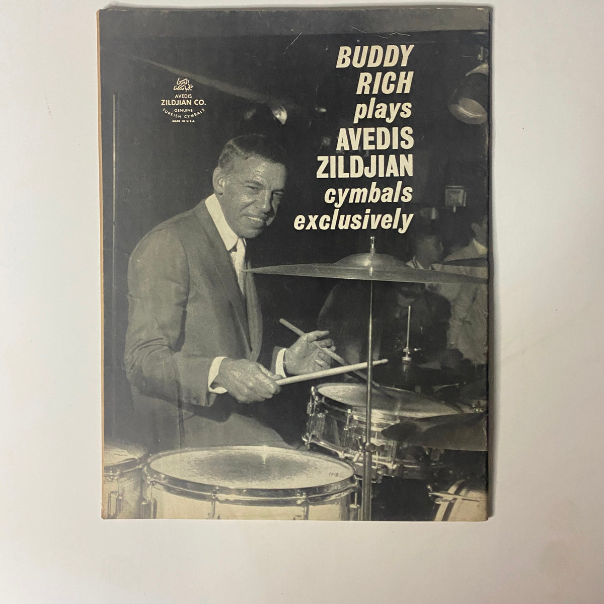 Vintage magazine cover featuring drummer Buddy Rich promoting Avedis Zildjian cymbals exclusively, showcasing a significant figure in jazz music.