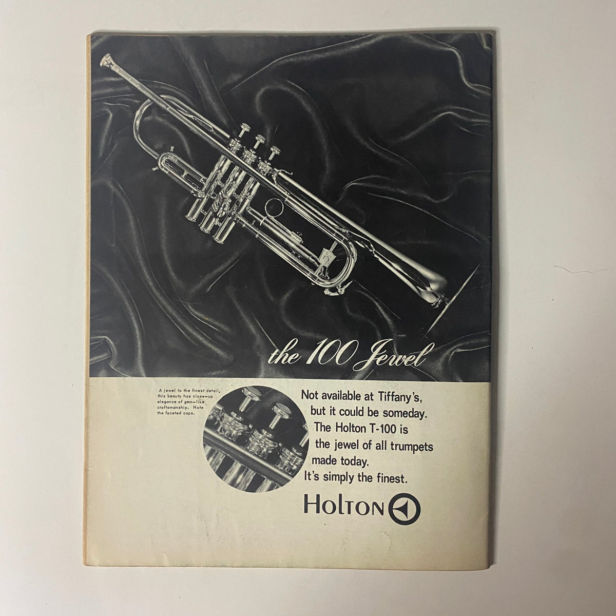 Advertisement for the Holton T-100 trumpet in Down Beat Magazine July 25, 1968, highlighting its quality and craftsmanship, appealing to music enthusiasts and trumpeters.