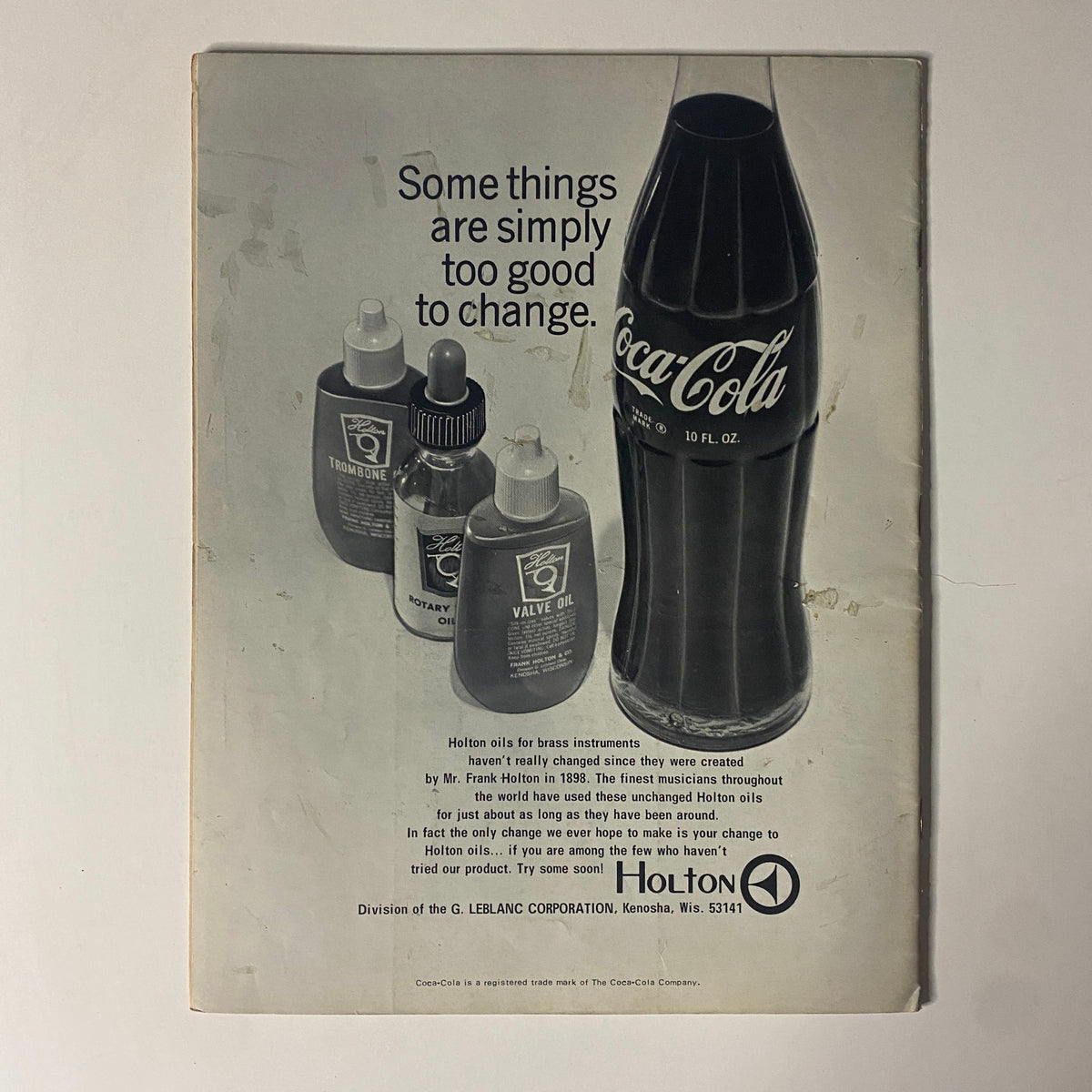 Back cover of Down Beat Magazine October 31, 1968, featuring an advertisement for Holton brass instrument oils and a Coca-Cola bottle.
