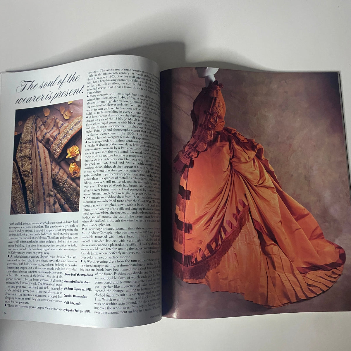 An article spread from Connoisseur Magazine January 1988 discussing fashion and clothing design. The page features a detailed description of fabric and a striking photo of a historical gown.