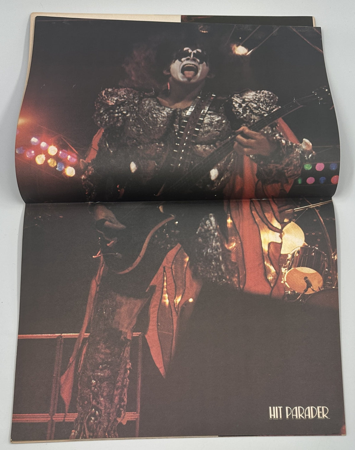 Promotional image of a KISS band member performing live, included in the Hit Parader Magazine Spring 1980 Annual.
