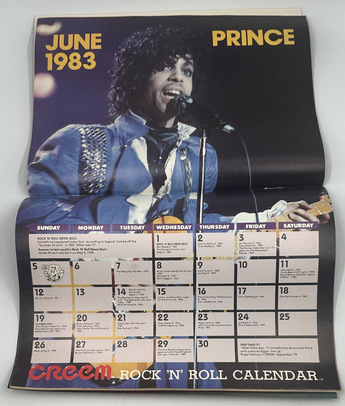 Prince colorful promotional calendar page from Creem Magazine June 1983, depicting a live performance by Prince with a vibrant stage presence.