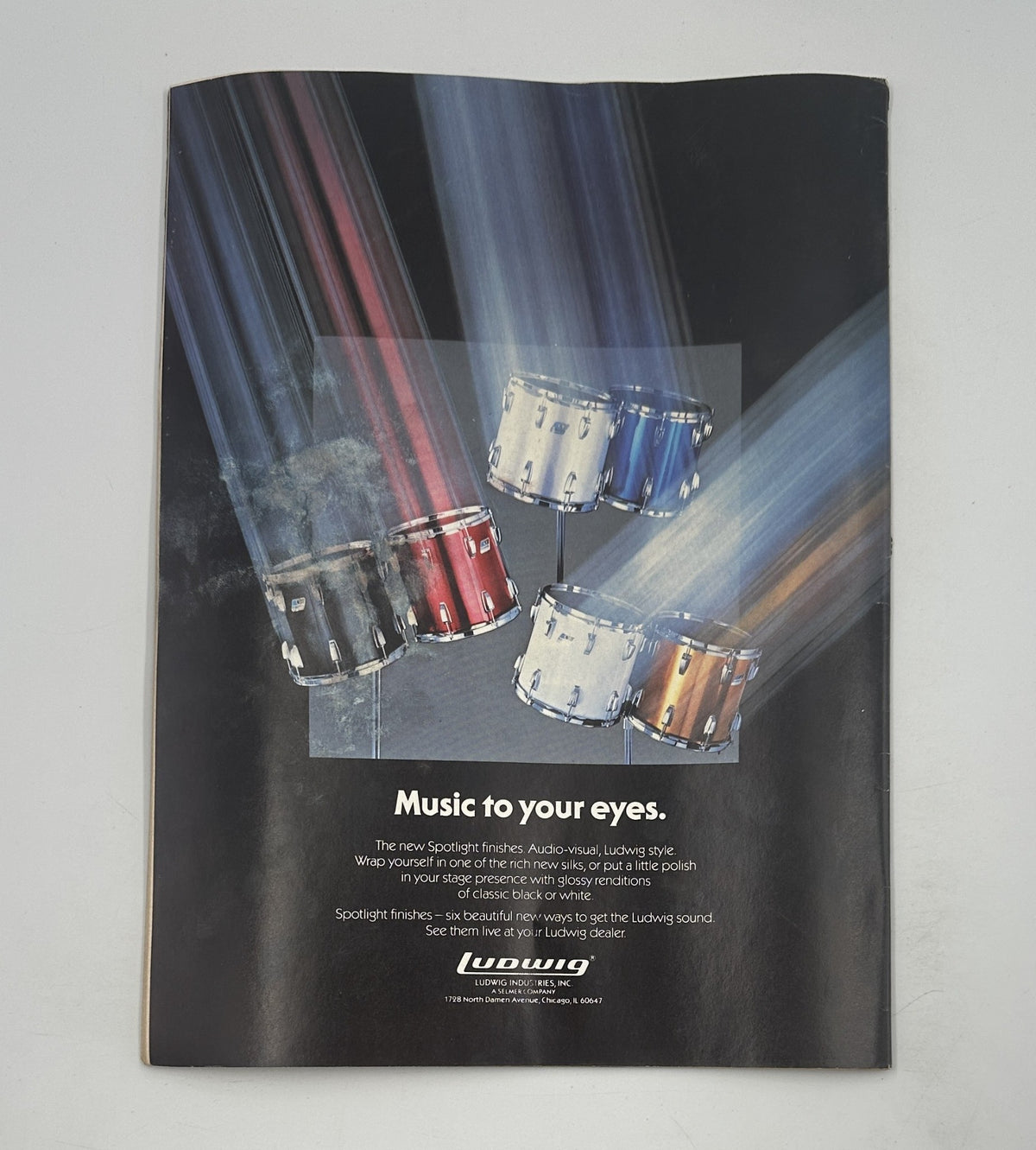 Back cover of Creem Magazine June 1983 featuring an advertisement for Ludwig drums, showcasing a dynamic drum set with a colorful spotlight effect.
