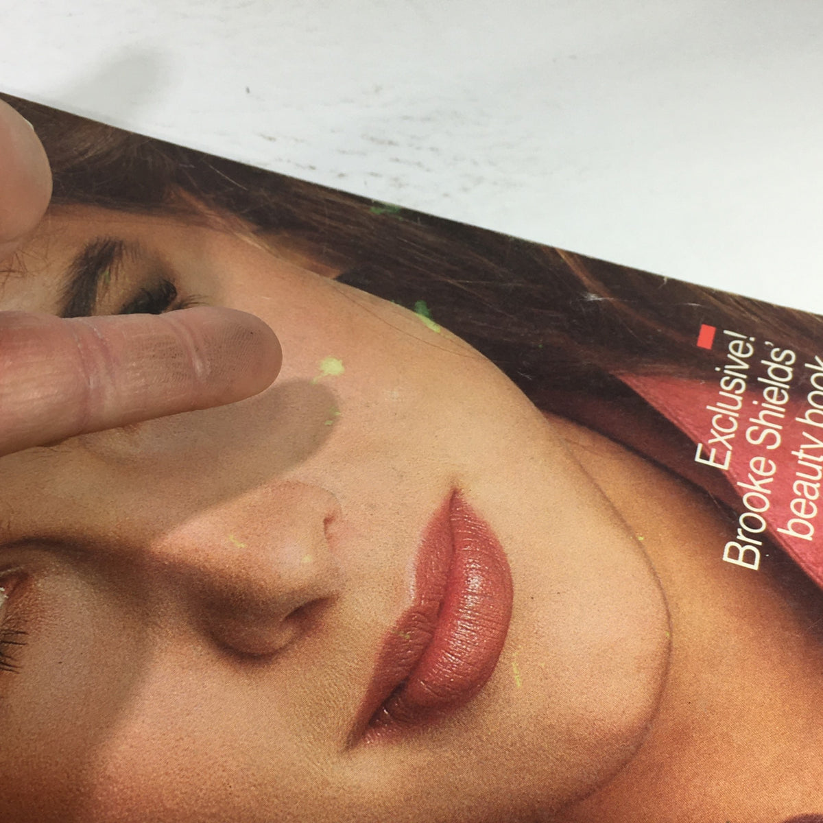 Detailed view of the VTG Harper's Bazaar Magazine: August 1981 cover, focusing on the tagline 'Exclusive! Brooke Shields' beauty book' alongside her captivating image.