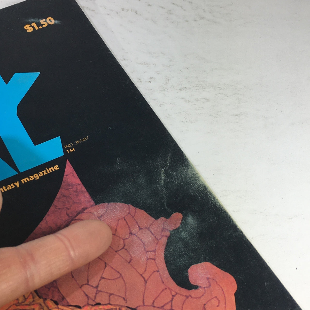 Detail of the top corner of VTG Heavy Metal Magazine: February 1978 highlighting the magazine's title and price, illustrating its vintage design and retro appeal.