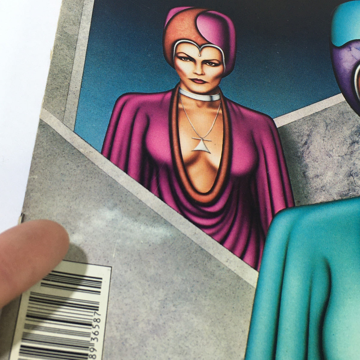 Close-up detail of the cover of Vintage Heavy Metal Magazine January 1981, showcasing the artistic depiction of futuristic women with dramatic fashion and expression.