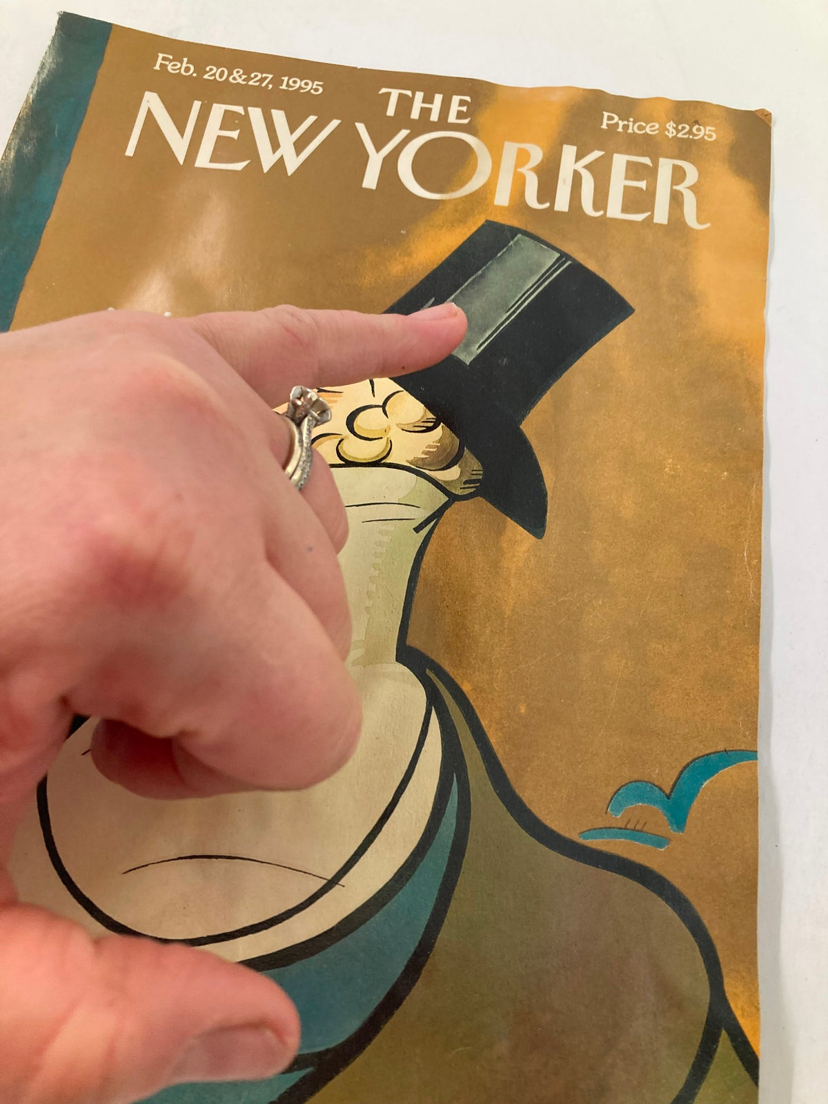Close-up view of The New Yorker cover for February 20 & 27, 1995 titled 'Game Master Tilley' illustrated by Rea Irvin, featuring a character in a top hat and playful design.