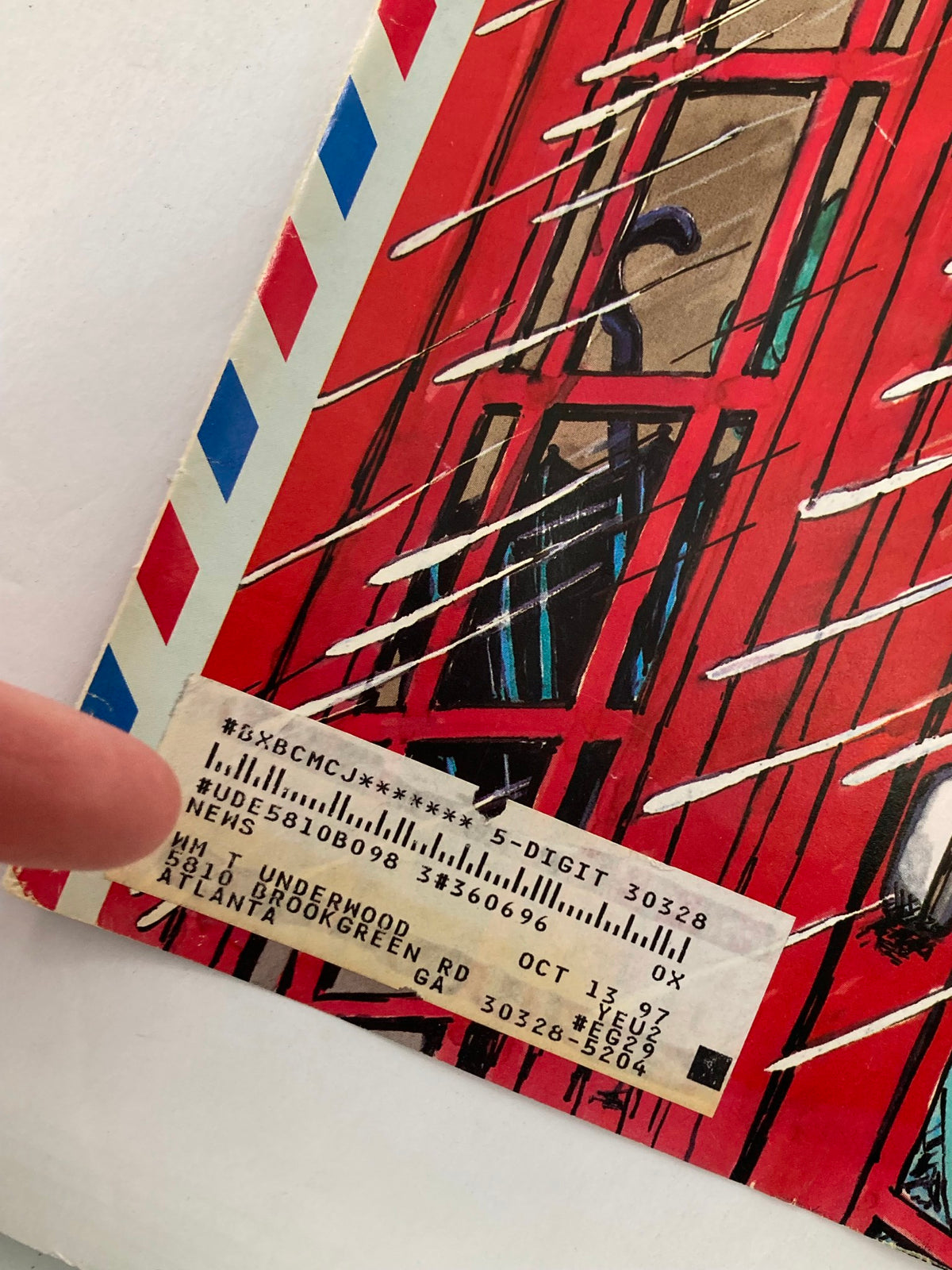 Close-up detail of The New Yorker cover from August 12, 1996, titled 'Phone Booth Romance', showing a telephone booth and a couple inside, with a visible price tag and publication details.