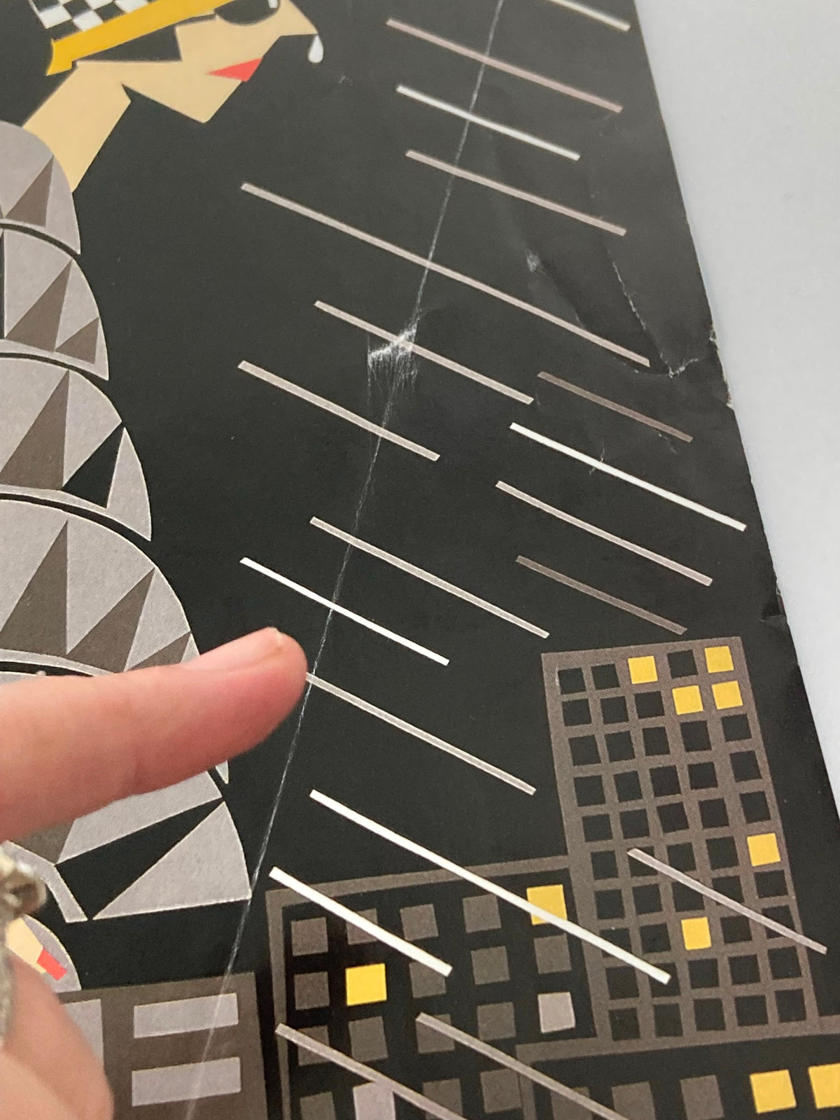 Detailed view of the cover of The New Yorker dated November 4, 1996, titled 'The Height of Fashion' by M. Roberts. The image captures a close-up of the geometric patterns and raindrops on the artwork.