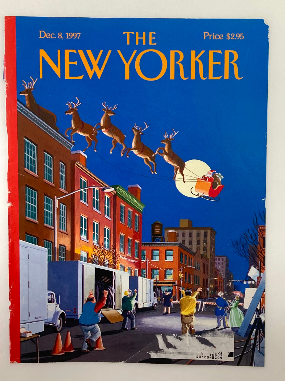 The New Yorker cover from December 8, 1997, titled "Cut!" by Bruce McCall, displaying colorful artwork of reindeer flying above a festive city street.
