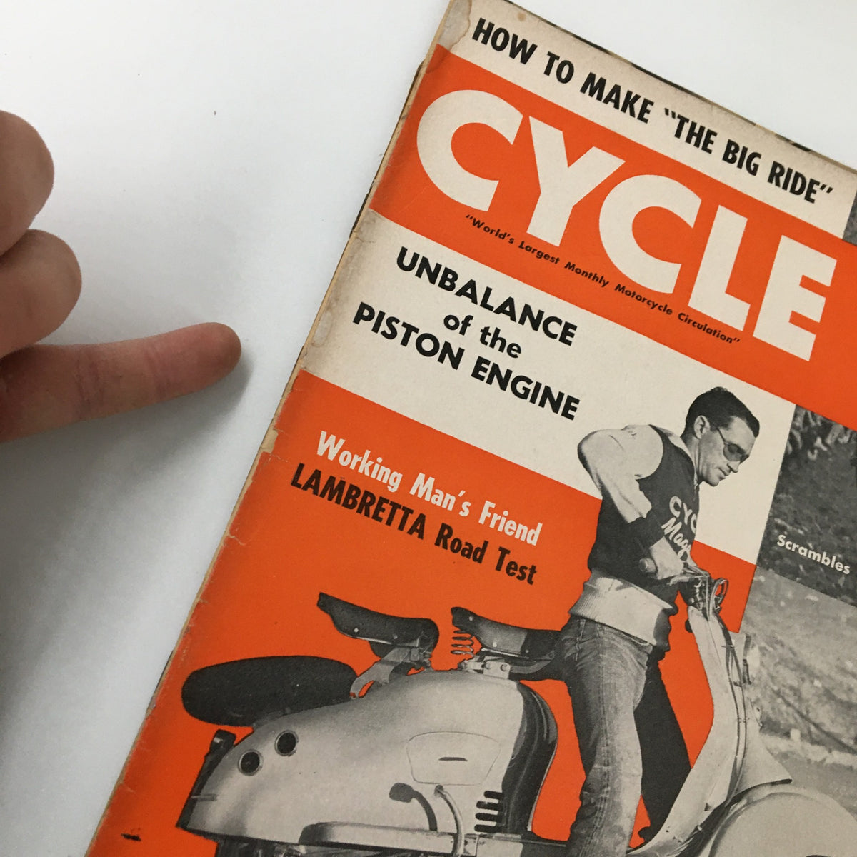 Close-up of the April 1953 Cycle Magazine cover, emphasizing its title and features including the Lambretta road test and motocross racing. This vintage magazine captures the essence of mid-20th century motorcycle enthusiasm.