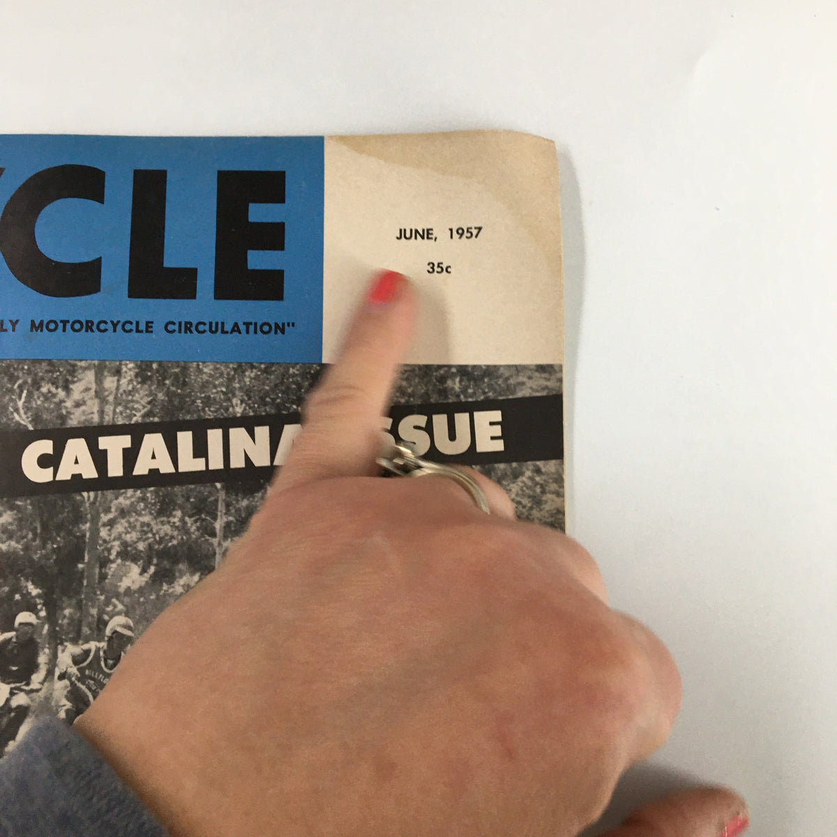 Close-up of the June 1957 date and price on the cover of VTG Cycle Magazine revealing key publication details.