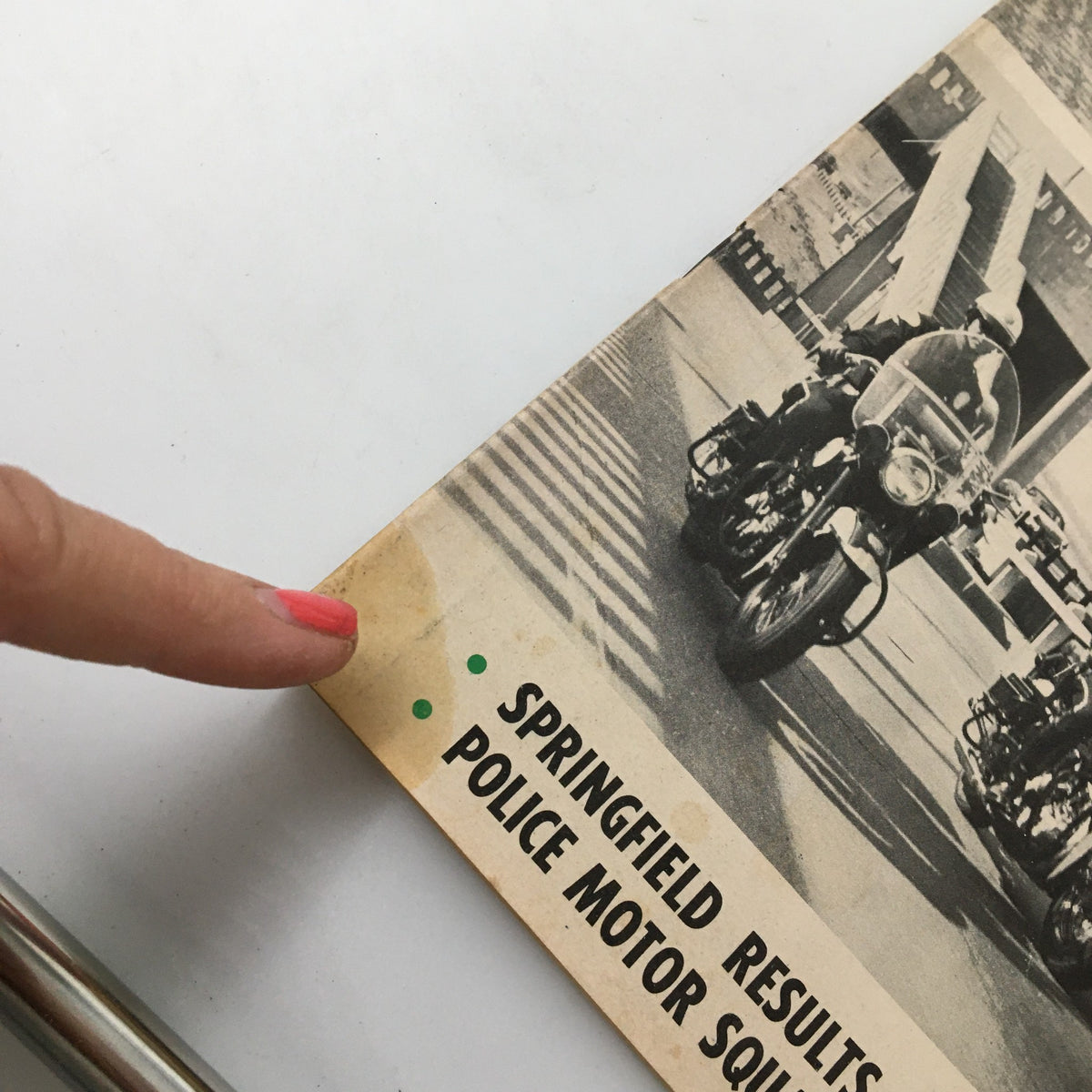 Close-up detail of the bottom corner of the cover of VTG Cycle Magazine October 1957, highlighting the Springfield results and police motor squad feature.