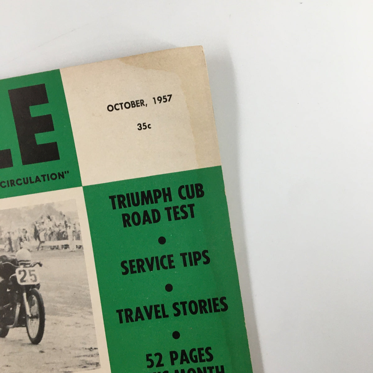 Close-up of the header section from VTG Cycle Magazine October 1957, displaying the publication date and highlighting features like Triumph Cub Road Test, service tips, and travel stories.