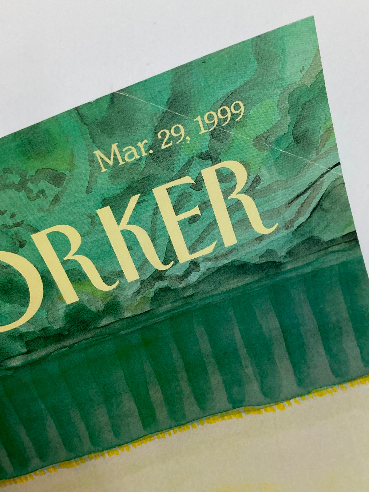 Close-up view of the logo and date from the cover of The New Yorker March 29, 1999, featuring the title in elegant font over a green watercolor background. This cover features the artwork 'Slight Anxiety' by Jean-Jacques Sempe.