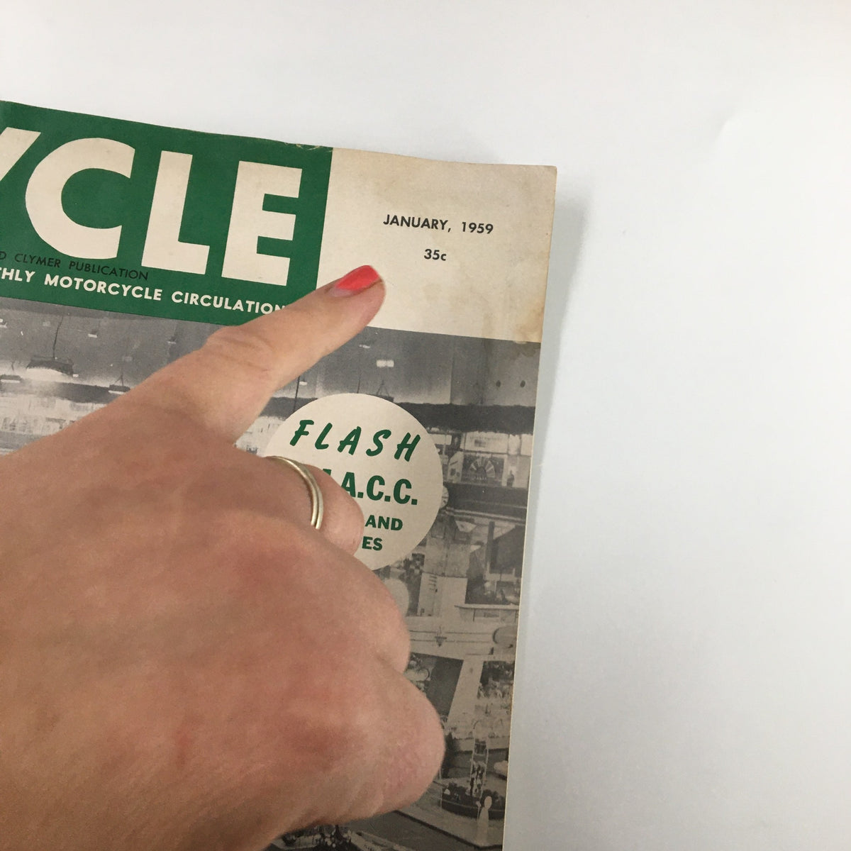 Detailed view of VTG Cycle Magazine January 1959 cover featuring a hand pointing at the publication date and price.