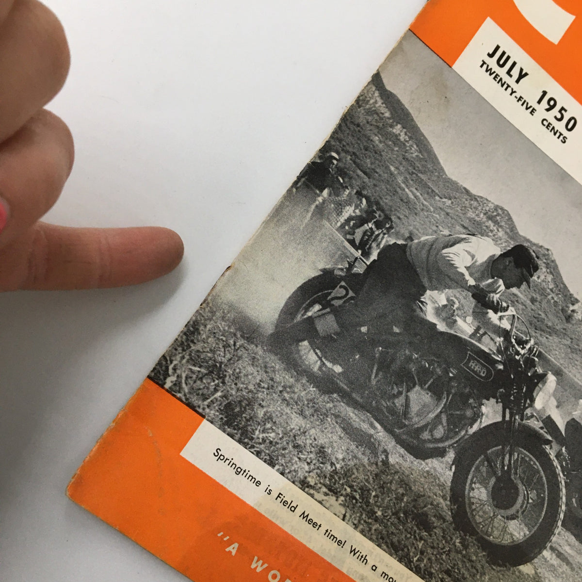 Close-up of the side edge of the VTG Cycle Magazine July 1950, showcasing vintage motorcycle racing graphic.