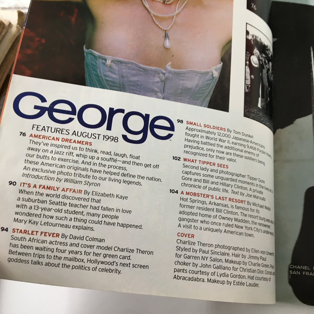 Inside page of George Magazine August 1998, showcasing features including an article about Charlize Theron, emphasizing her journey and the magazine's cultural context.