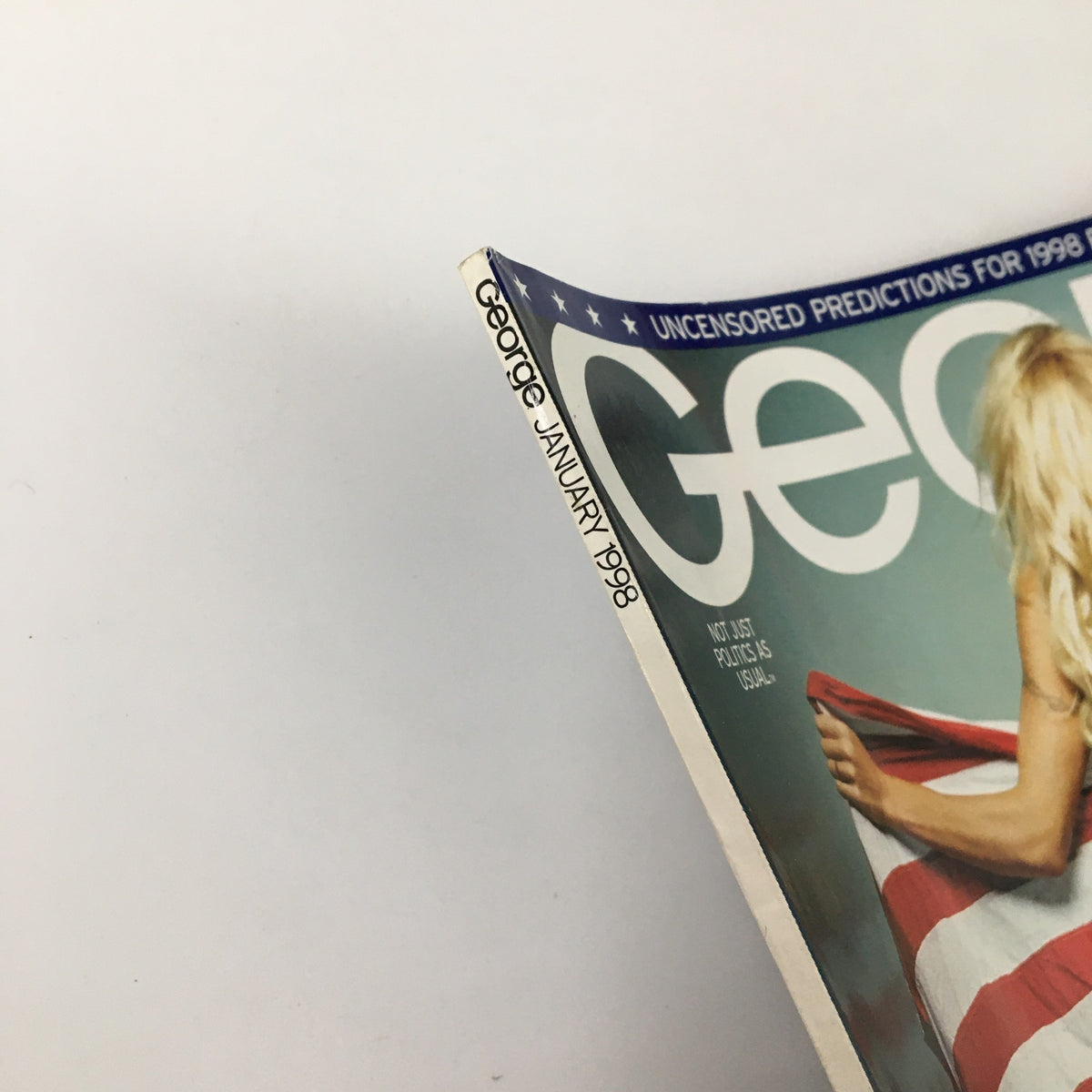 Cover of George Magazine January 1998 featuring Pamela Lee, showcasing its title and iconic design elements.