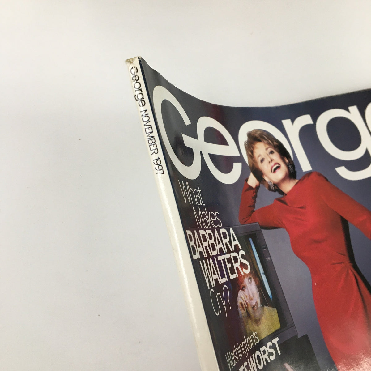 Side view of George Magazine November 1997 showing the title and issue date, highlighting Barbara Walters and features of the magazine. A collectible vintage magazine from the late 90s.
