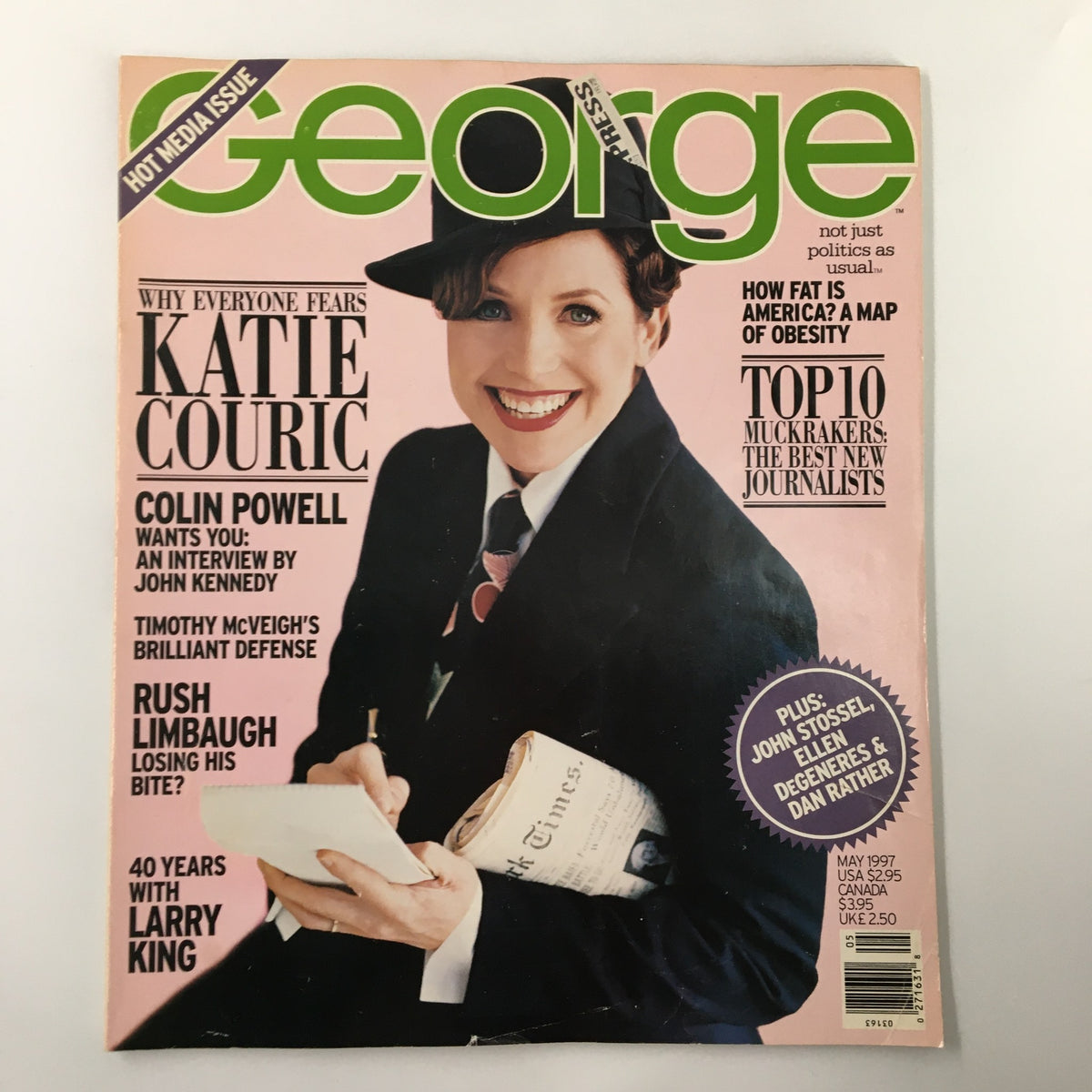 Cover of George Magazine May 1997 featuring a smiling Katie Couric in a hat, highlighting exclusive articles including Colin Powell's interview and a tribute to 40 Years with Larry King.