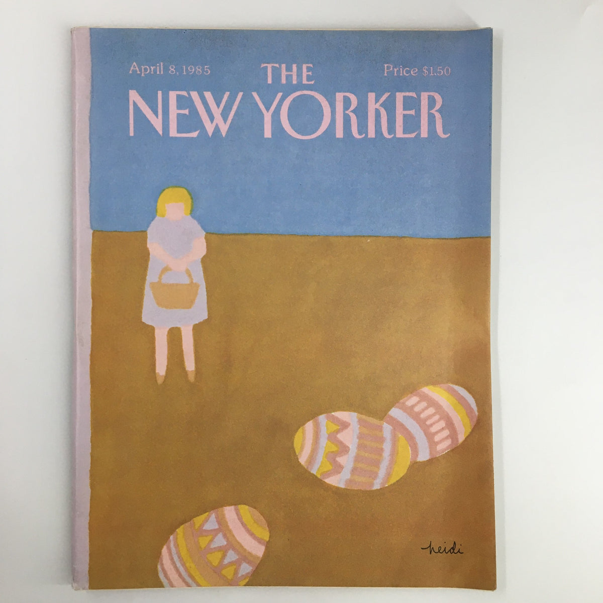 The New Yorker Magazine April 8 1985 Easter Egg cover featuring a whimsical illustration by Heidi Goennel, depicting a girl with a basket beside colorful Easter eggs on a sandy background.