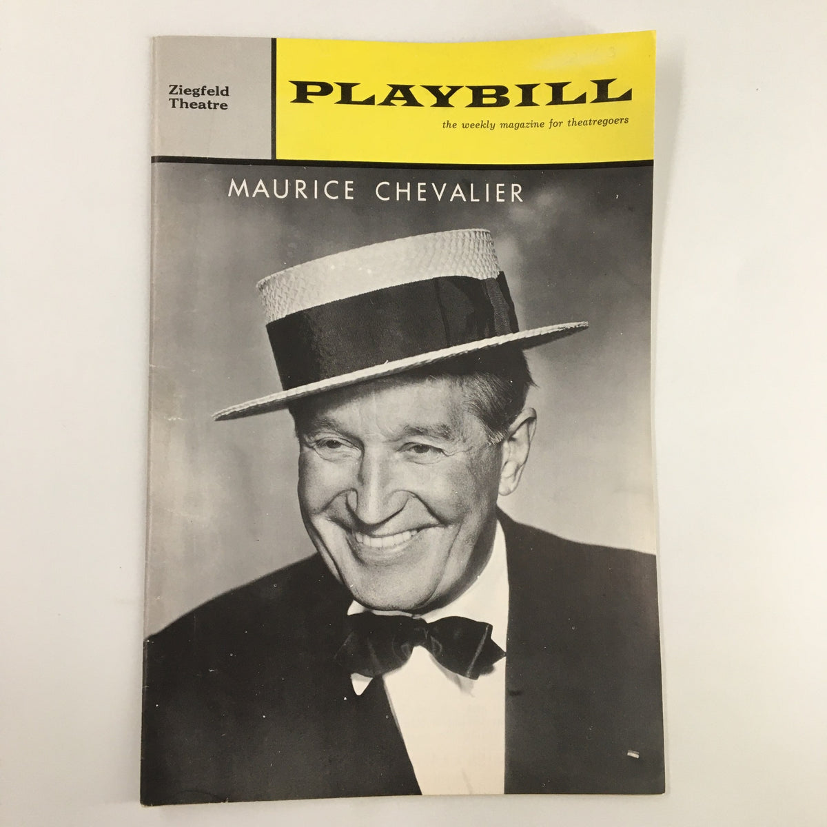 1963 Playbill Ziegfeld Theatre featuring Maurice Chevalier smiling, wearing a hat, representing the charm of vintage Broadway entertainment.