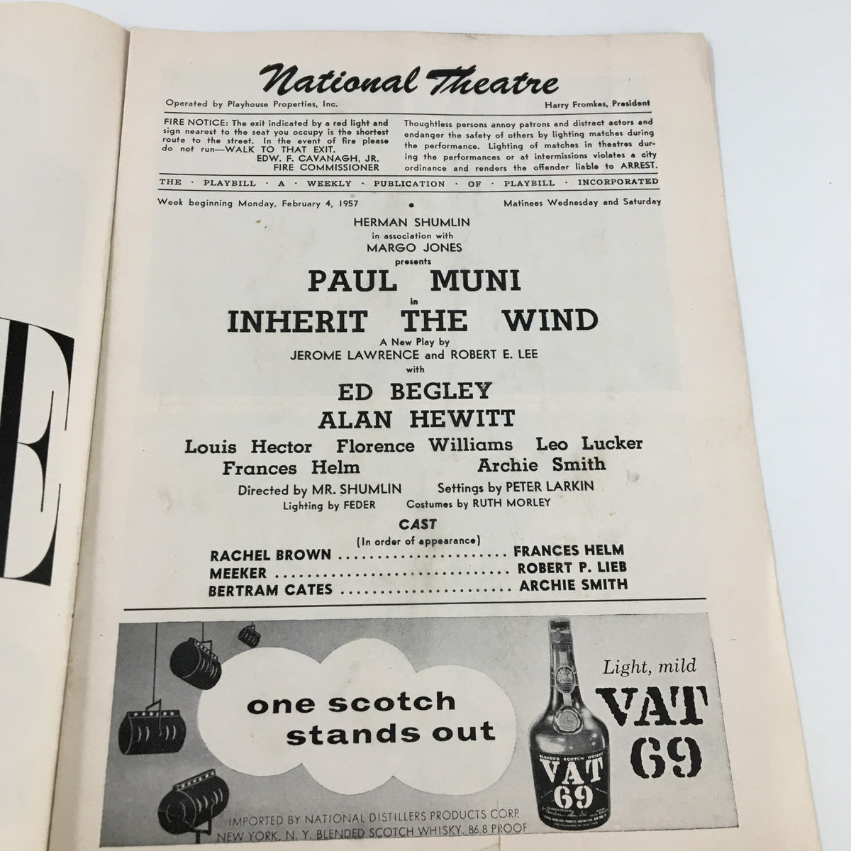 Interior page of the 1957 Playbill National Theatre for Inherit The Wind, listing cast and crew details including Paul Muni, along with historical theater information.
