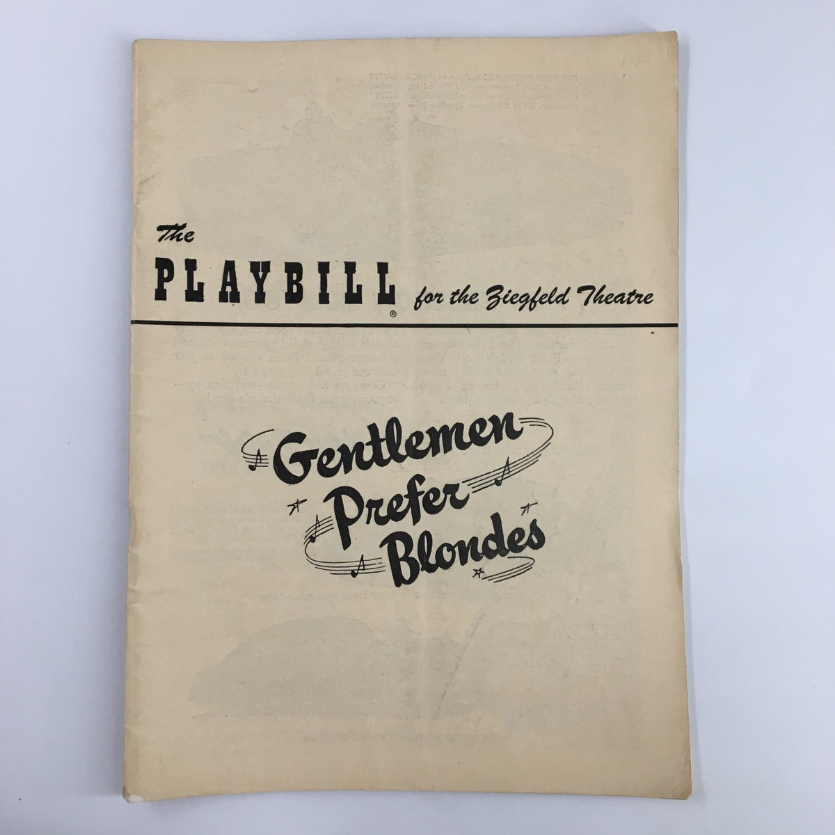Vintage 1950 Playbill for the Ziegfeld Theatre featuring 'Gentlemen Prefer Blondes' with iconic title design and aged paper texture.