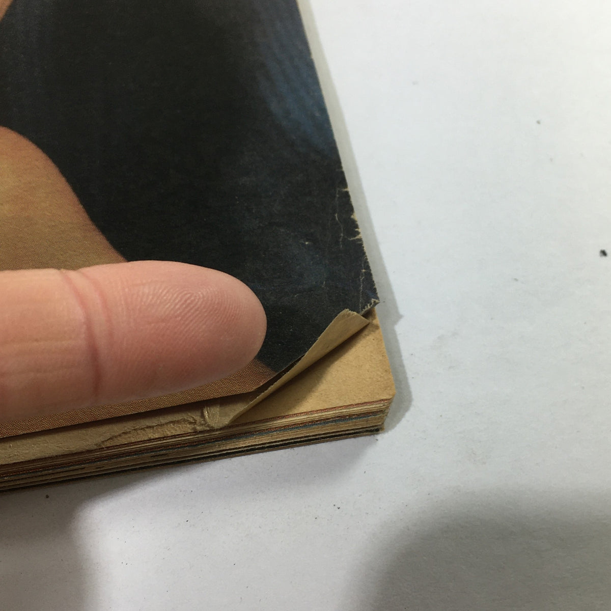 A close-up view of minor wear on the edge of VTG Rolling Stone April 14 1983 magazine, indicating its vintage condition.