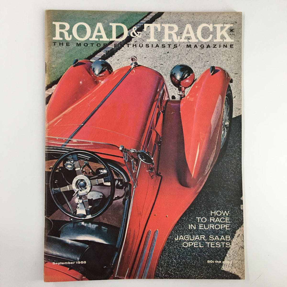 Cover of VTG Road & Track Magazine, September 1958, featuring a stunning red sports car and the headline 'How to Race in Europe'. This vintage magazine includes Jaguar, Saab, and Opel tests.