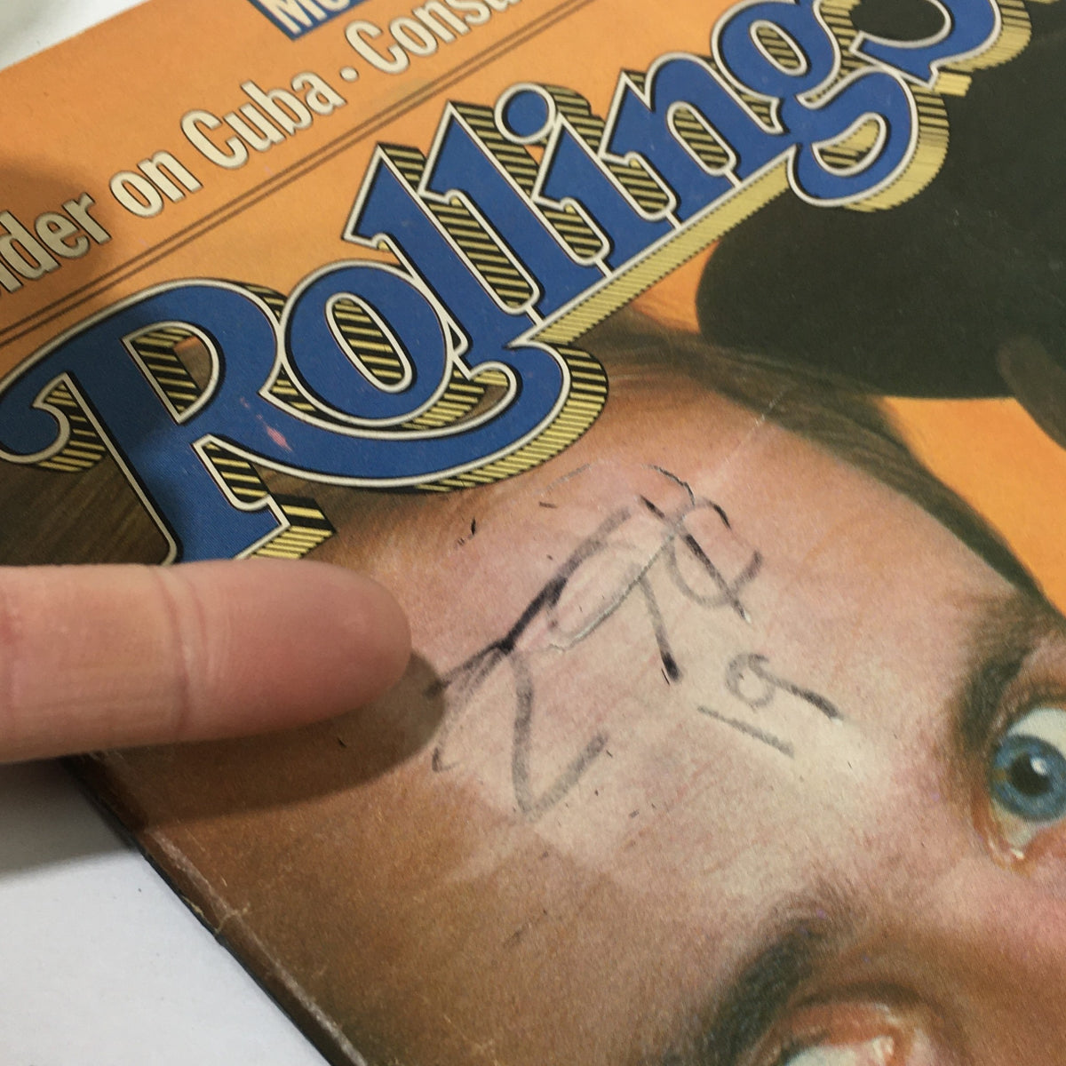Detailed shot of the cover of the June 23, 1983 Rolling Stone Magazine showcasing Men At Work, including writing on the cover and signs of age.