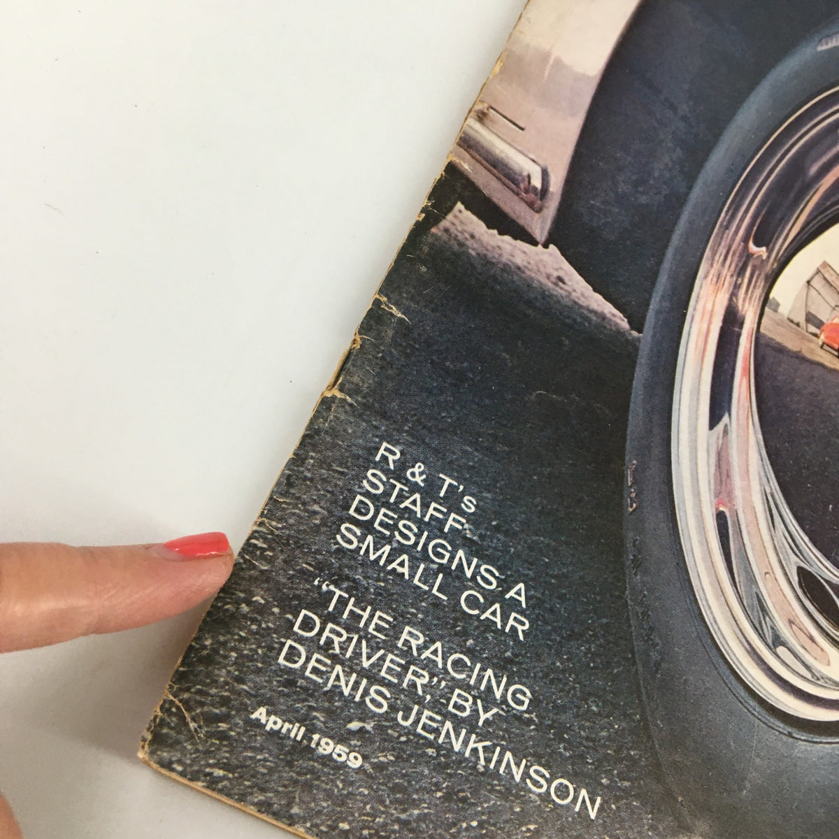 Close-up of the cover of VTG Road & Track Magazine April 1959 showcasing the title and part of the cover design related to R&T staff's small car designs.