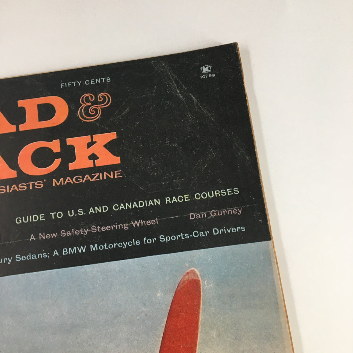Cover of VTG Road & Track Magazine October 1959 showcasing the title and features related to compact luxury sedans and racing.