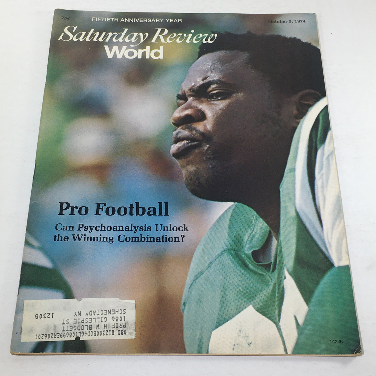 Cover of VTG Saturday Review World: October 5, 1974 featuring a pro football player with an intense expression, asking if psychoanalysis can unlock the winning combination in football. The magazine captures the nostalgic essence of 1970s football.