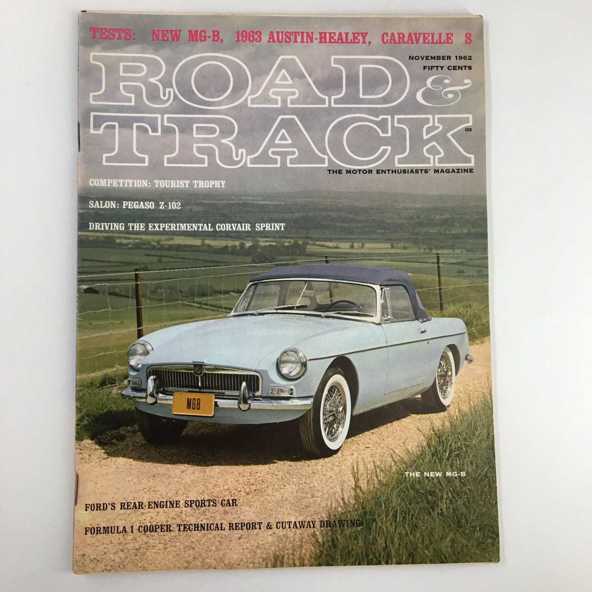 Cover of the November 1962 edition of Road & Track Magazine featuring Ford's Rear-Engine Sports Car, with an MGB convertible displayed on a scenic rural road.